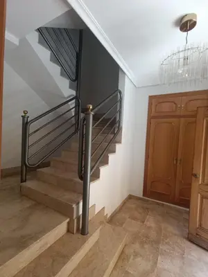 a staircase in a house with a stair railing at First Floor Casa Privee - Two bed Beach Terrace & Balconies in Puerto de Sagunto
