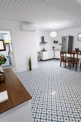 a white kitchen with a stove and a refrigerator at Cullera Center, 15 min Beach in Cullera