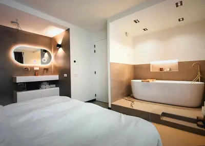 a bedroom with a bed and a tub and a sink at Costa de Valencia Comfort in Torrent