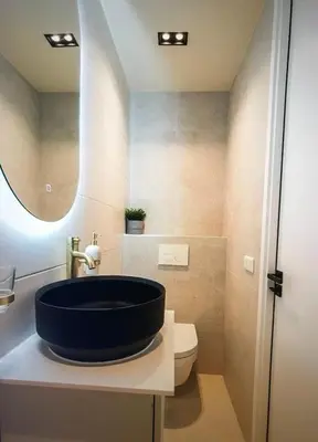 a bathroom with a blue sink and a toilet at Costa de Valencia Comfort in Torrent