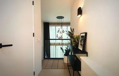 a hallway of a home with a staircase and a window at Costa de Valencia Comfort in Torrent