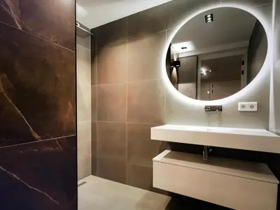 a bathroom with a sink and a mirror at Costa de Valencia Comfort in Torrent