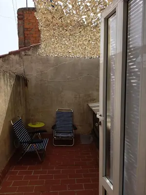 two chairs and a table in a small room at La Senia in Moncófar