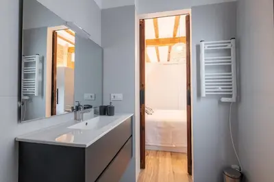 a bathroom with a sink and a mirror at Grandma's fishermen's house in Cabanyal in Valencia