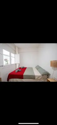 a bedroom with a bed and a window at Habitación El Cabanyal in Valencia
