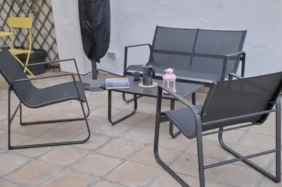 a table and two chairs and a table and a table and chairs at Romantic Apartment Botanico by Virkin Suites in Valencia