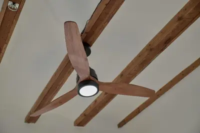 a ceiling fan with wooden beams on a ceiling at Romantic Apartment Botanico by Virkin Suites in Valencia