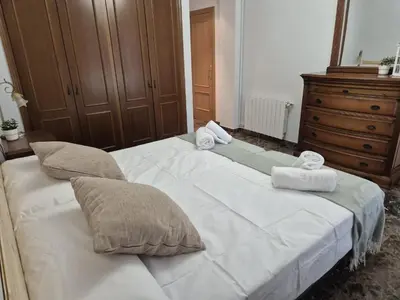 a bedroom with two beds with towels on them at PINEDO PLAYa in Valencia