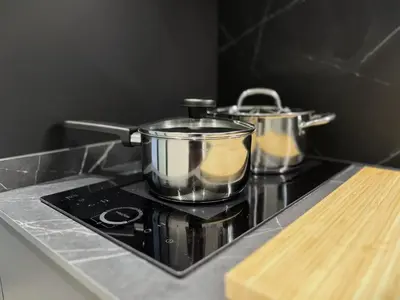 two pots and pans sitting on top of a stove at BC22 - LoftValencia in Valencia