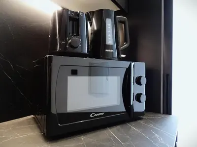a coffeemaker with two microwaves on top of it at BC22 - LoftValencia in Valencia