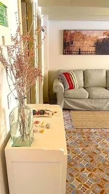 a living room with a vase on a table at Apartamento Joaquín Sorolla - Patraix in Valencia