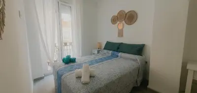 a bedroom with a bed with a teddy bear on it at Habitaciones VIP en Vivienda Compartida, Muy Céntricas, Ruzafa Centro, Bonitas y Tranquilas in Valencia