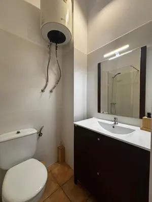a bathroom with a toilet and a sink at El mirador de Espadán in Segorbe
