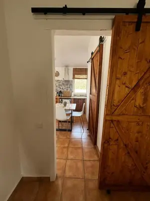 a kitchen with a stove and a sink and a window at El mirador de Espadán in Segorbe