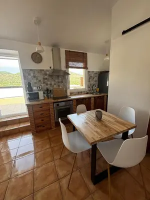 a fireplace in a room with a brick wall at El mirador de Espadán in Segorbe
