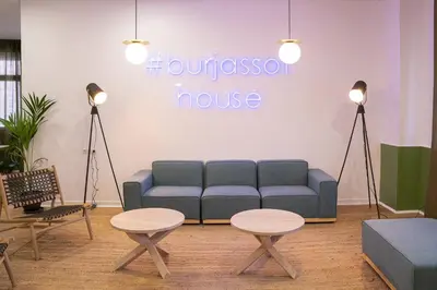 a living room with a couch and two tables at MiCampus Burjassot 1 Student Residence in Burjasot