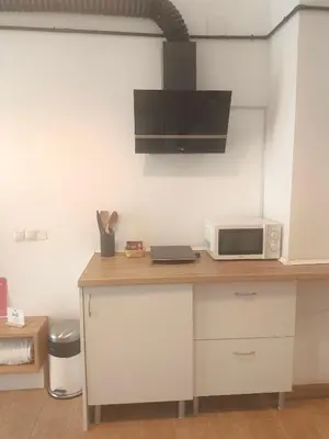 a kitchen with a counter top with a microwave at Central Cozy Ground Floor Studio in Valencia