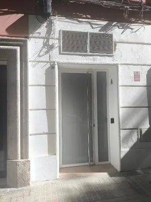 an open door of a building with an air conditioner at Central Cozy Ground Floor Studio in Valencia