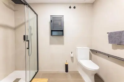 a bathroom with a toilet and a glass shower at Loft Urban Beach - Cerca del Mar in Valencia