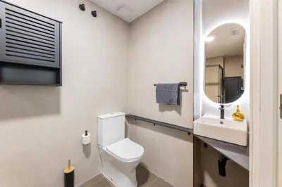 a bathroom with a toilet and a sink at Loft Urban Beach - Cerca del Mar in Valencia