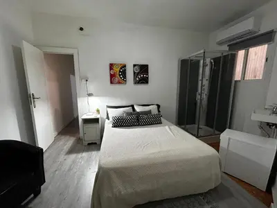 a bathroom with two toilets and a sink at apartamento livia in Valencia