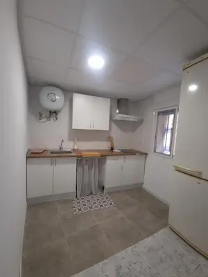 a kitchen with a counter and a sink in it at Rural studio in Cortez de Pallas