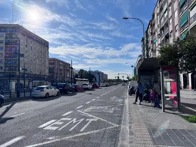 a city street with cars parked on the side of the road at Habitación privada con baño privado I in Valencia