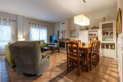a living room with a table and a dining room at Casa Potelos by Concept Flats in Navajas