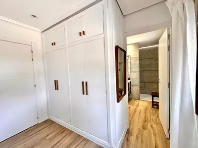 a large white closet in a room with wood floors at Villa El Plantio in Pla del Pou