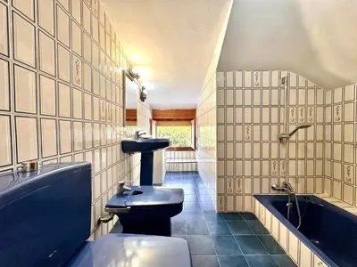 a bathroom with a toilet and a sink and a tub at Villa El Plantio in Pla del Pou
