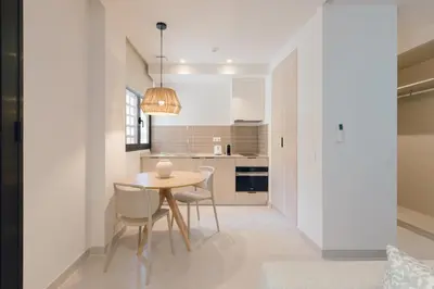 a kitchen and dining room with a table and chairs at GuestReady - Reental Apartments in Valencia