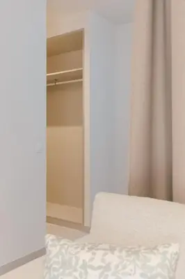 a bedroom with a bed and a closet at GuestReady - Reental Apartments in Valencia