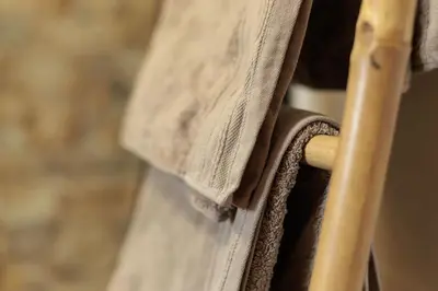 a close up of a wooden chair with a towel at Apartamento Estilo Rustico Buñol - ELPATIO- in Buñol