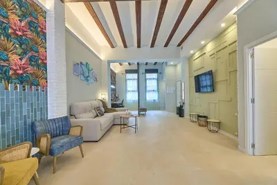 a living room with a couch and a table at Invalencia - Alberic Jungle R House in Valencia