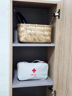 a bag and a basket on a shelf in a closet at La Marina de Coup de Coeur Appartments in Valencia