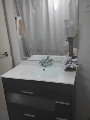 a bathroom with a white sink and a mirror at Ca'l Suecà in Chella