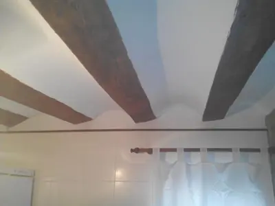 a ceiling in a bathroom with a white curtain at Ca'l Suecà in Chella
