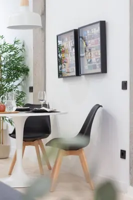 a dining room with a table and a chair at Manya Valencia by Concept Flats in Valencia