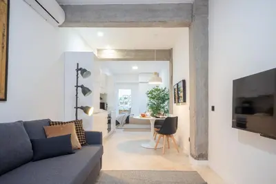 a living room with a couch and a table at Manya Valencia by Concept Flats in Valencia