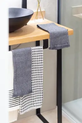 a bathroom with two towels hanging on a counter at Manya Valencia by Concept Flats in Valencia