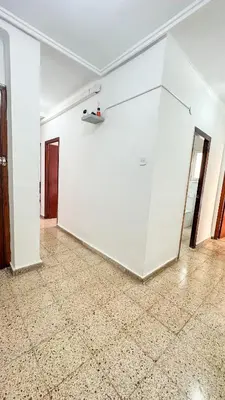 an empty room with white walls and tile floors at Kmilo in Valencia