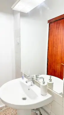 a bathroom with a white sink and a mirror at Kmilo in Valencia