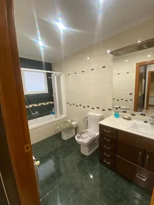 a bathroom with a toilet and a sink and a mirror at Casa Flare Apartmento para 6 personas en Cheste in Cheste