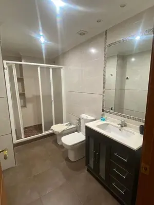 a bathroom with a toilet and a sink and a mirror at Casa Flare Apartmento para 6 personas en Cheste in Cheste