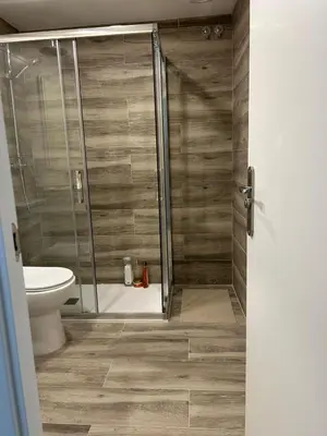 a shower stall in a bathroom with a toilet at District Key - Valencia, Manuel Candela in Valencia