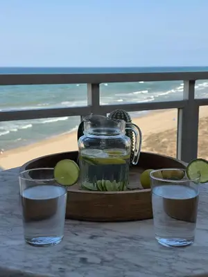 a tray with a pitcher of water and two glasses at Ca Ulises Frente al mar, pensado para desconectar in Valencia