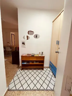 a room with a table next to a door at El Molino 2 Buñol Apartamento in Buñol