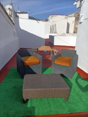 a rendering of a room with chairs and a table at El Molino 2 Buñol Apartamento in Buñol