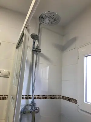 a shower with a shower head in a bathroom at Torres del Saler, Gola de Puchol, Valencia in Valencia