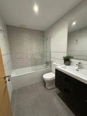 a bathroom with a tub and a toilet and a sink at UIM Mediterraneo Hispanidad 4 Wifi in Puerto de Sagunto
